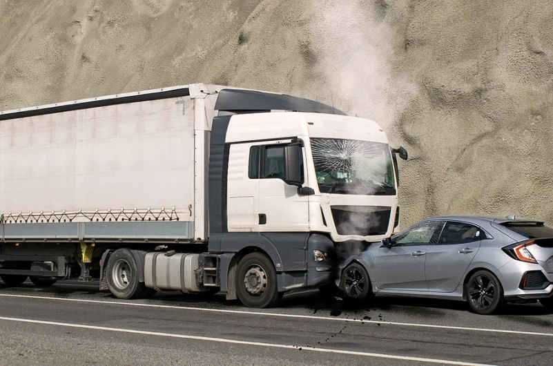 Truck and car in head on collision