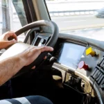 Truck driver looking out over dashboard